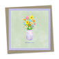get well soon – spring flowers in vase